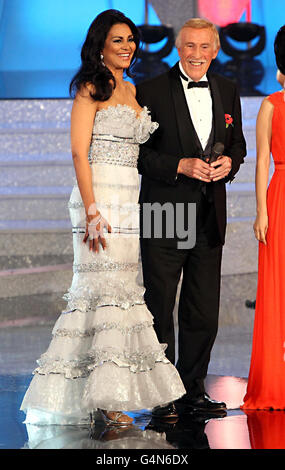 Entertainer Sir Bruce Forsyth and his wife, former Miss World 1975, Wilnelia Merced, on stage during the 2011 Miss World final from Earls Court in London. Stock Photo