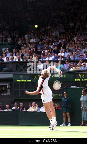 No commercial use. Germany's Boris Becker smashes a serve to fellow German Nicolas Kiefer, during their second round match at the Wimbledon tennis championships. Stock Photo