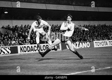 Johann Cruyff (right) of Feyenoord is beaten in a tackle by Tottenham Hotspur's Glenn Hoddle during a UEFA Cup second round first leg game at White Hart Lane in London. Stock Photo