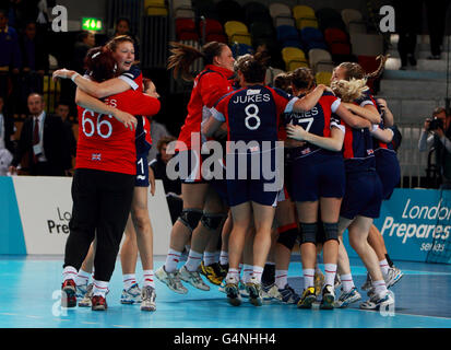 Great Britain's handball team celebrate their victory over Angola during the London Handball Cup and 2012 test event at the Olympic Park, London. Stock Photo