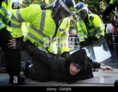 A student demonstrator is arrested near the Stock Exchange in London, during the latest student fees march. Stock Photo
