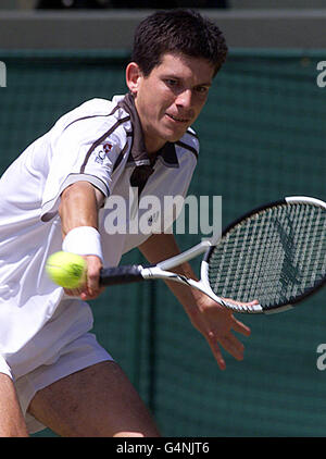 No Commercial Use: British tennis star Tim Henman in action during his quarter final match against Cedric Pioline of France at Wimbledon. Henman won the match 6-4, 6-2, (4-6) 6-3. Stock Photo