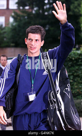 No Commercial Use. British tennis star Tim Henman waves to his fans as he arrives at Wimbledon. Henman will play American Pete Sampras in the semi-final. Stock Photo