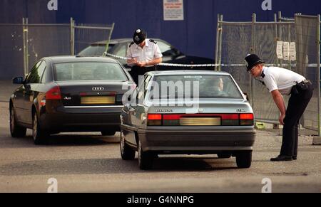 Police activity outside Stamford Bridge, home of Chelsea Football Club. An investigation is under way after a charred body was found after a blast at Chelsea stadium. * Police forensic scientists and firemen were called to the Premiership team s ground in south-west London to investigate the blast that ripped through part of the club s West stand. Stock Photo