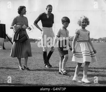 Queen Elizabeth II with Prince Charles and Princess Anne during a break in the polo tournament, in which the Duke of Edinburgh was playing at Smith's Lawn in Windsor Great Park. Stock Photo