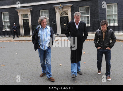 Presenters of the television car show Top Gear from left James May, Jeremy Clarkson and Richard Hammond outside 10 Downing Street in London, where they were filming an episode of the BBC's Top Gear show. Stock Photo