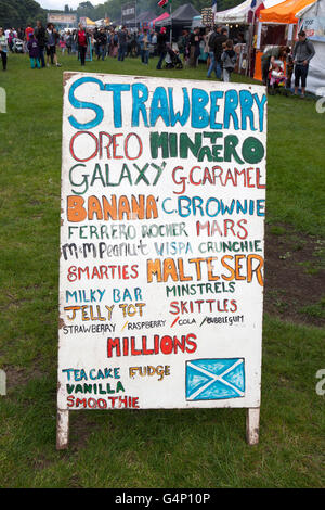 A Board advertising fruity drinks; Food stall vans at the Africa Oye festival in Sefton Park, Liverpool, Merseyside, UK