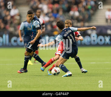 Vancouver, Canada. 18 June, 2016. Vancouver Whitecaps forward Nicolas Mezquida (11), being challenged for the ball. Vancouver Whitecaps vs New England Revolution, BC Place Stadium.  Final Score New England wins 2-1. Credit:  Gerry Rousseau/Alamy Live News Stock Photo