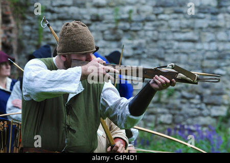 Greenwich, London, UK. 18th June, 2016. Re-enactors dressed as medieval bowmen during a re-enactment in Greenwich, London, UK. The 'Grand Medieval Joust' was held at Eltham Palace, an English Heritage property which was the home of King Henry VIII as a child. The event aims to give an insight into life at the palace during the medieval period. Credit:  Michael Preston/Alamy Live News Stock Photo