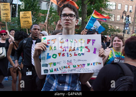 New York, USA. 18th June 2016. Demonstrators rally in front of Stonewall Inn. Members and supporters of the LGBT community rallied at Stonewall Inn in Greenwich Village in solidarity with Orlando after a march from Grand Central Terminal. Credit:  M. Stan Reaves/Alamy Live News Stock Photo