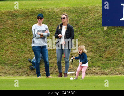 Zara Tindall and Mia . . Tetbury, Gloucestershire . . 18.06.2016 Mia Tindall (2) plays with a polo stick and ball near her mother Zara Tindall (Philips), eldest granddaughter of HM Queen Elizabeth II. Her Uncle, Prince William, Duke of Cambridge, played polo, and Uncle Prince Harry (of Wales), supported his brother.  Credit:  Paul Marriott/Alamy Live News Stock Photo