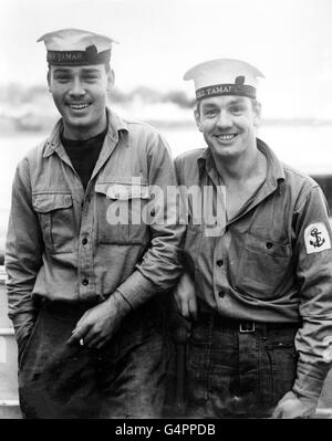 Home after five months as prisoners of the Chinese Communists are two Royal Navy ratings, Able-Seaman G.B Wise (left) and Leading-Seaman R. G. Creswell. They are pictured at Southampton on their arrival from Hong Kong in the troopship SS Dilwara. Stock Photo