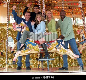 Members of the cast of TV soap EastEnders relax during a break in filming at Brighton. From left: Todd Carty, who plays Mark; Jimi Mistry - Fred Fonseca; Danniella Morgan - Sam; Tamzin Outhwaite - Melanie; Sylvester Williamson - Mick. Stock Photo