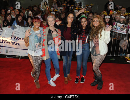 X Factor contestants Little Mix with their mentor Tulisa Contostavlos (centre) arrive for a gig at Temple Park leisure centre in South Shields. PRESS ASSOCIATION Photo. Picture date: Tuesday December 6, 2011. Photo credit should read: Owen Humphreys/PA Wire Stock Photo