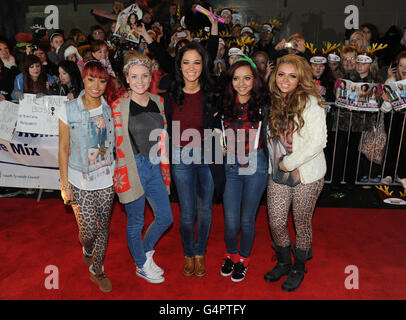 X Factor contestants Little Mix with their mentor Tulisa Contostavlos (centre) arrive for a gig at Temple Park leisure centre in South Shields. Stock Photo