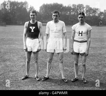 Harold Abrahams, chairman of the British amateur Athletic board from 1968 to 1975, and the only British athlete ever to win an Olympic Sprint championship. He is pictured here with T. Campbell (l) of Yale and J.W. Burke of Harvard (r) at a training session for US athletes at Cambridge. Stock Photo