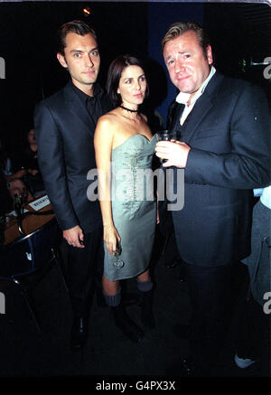 Actress Sadie Frost with husband actor Jude Law (left) and actor Ray Winstone (right) at the Home nightclub after the film premiere of Final Cut. Stock Photo