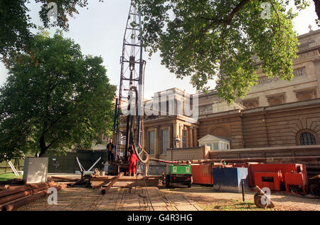 Workmen look on as drilling starts on a new 150-metre deep bore hole at Buckingham Palace in London. Water from the bore hole will be used to provide water for the air conditioning unit in the redeveloped Queen's Gallery. * The bore-hole is capable of supplying up to 2.5 million litres of water a day. Stock Photo