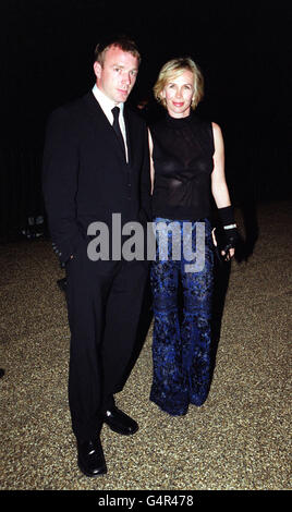 Film Director Guy Ritchie with Trudie Styler, wife of singer Sting, arrive at the Serpentine Gallery in London for a party following the UK premiere of the film 'Eyes Wide Shut' directed by the late Stanley Kubrick and starring Tom Cruise and Nicole Kidman. * Guy Ritchie directed the film Lock Stock and Two Smoking Barrels. Stock Photo