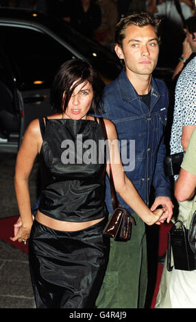 Husband and wife, actor Jude Law and actress Sadie Frost arrive at the opening party of 'Home', the biggest nightclub in the UK (seven floors), in Leicester Square, London. Stock Photo