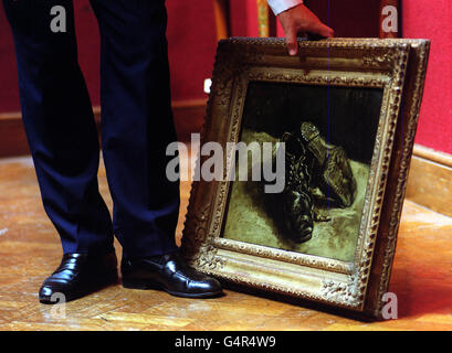 Jussi Pylkkanen, Senior Director of 19th Century Art at Christie's auctioneers holds the only painting from Vincent Van Gogh's famous shoe series still in private hands, not seen in public for over 50 years. 'A pair of Shoes 'is estimated to fetch 1.2-1.6 million. Stock Photo