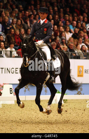 Great Britain's Carl Hester riding Uthopia in the Reem Acra FEI Grand Prix Freestyle during the London International Horse Show at Olympia, London. Stock Photo