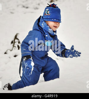 Two-year-old Ethan Woodley enjoys playing in the snow in Whitburn ...