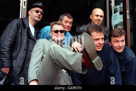 Pop group Madness (from left) Chris Foreman, Cathal Smyth, Mike Barson, Suggs, Mark Bedford and Daniel 'Woody' Woodgate at the Dr Martens store in London's Covent Garden to launch the limited edition 1460 boot which is embossed with the band's logo. Stock Photo