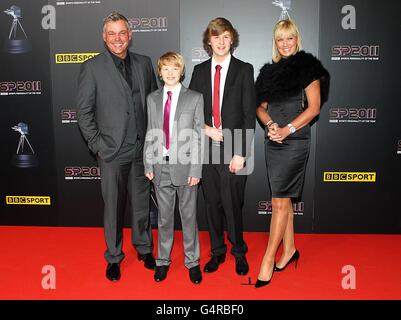 Golfer Darren Clarke with his sons Conor and Tyrone and partner Alison Campbell arriving for the Sports Personality of the Year Awards 2011, at MediaCityUK, Salford, Manchester. Stock Photo