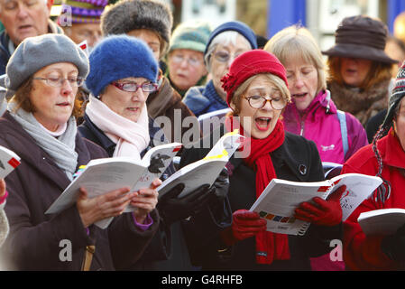 Carol singers entertain Christmas shoppers in Chichester, West Sussex, on what is expected to be one of the busiest shopping days of the year. Stock Photo