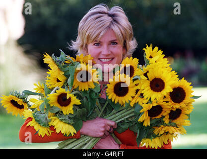 Former GMTV presenter Anthea Turner holding Sunflowers at the launch of the Live Every Moment Appeal, the UK Hospice movement's biggest ever fundraising appeal, organised by Help the Hospices and Sainsbury's, at Princess Alice Hospice in Surrey. * Live Every Moment badges, in the shape of a Sunflower will be on sale in all Sainsbury's stores, price 1 each, thoughout October. Miss Turner announced ner engagement to Grant Bovey earlier this week just three weeks after her divorce from former Radio One DJ Peter Powell and a month after 38-year-old Mr Bovey s divorce from his wife Della. Stock Photo