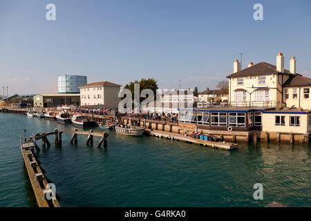waterside pub and crowds on quayside at Littlehampton Marina Stock