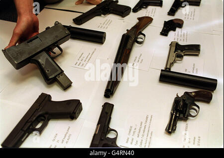 This is the terrifying haul of guns used by gangsters in some of the 21 Yardie-style murders, on display at New Scotland Yard. The cache includes a MAC-10 machine pistol, known as Big Macs in the underworld and capable of firing 10 rounds a second. * Also on display were sawn-off shotguns and pistols . Stock Photo