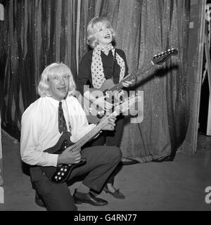 In a long haired blond wig, actor Bernard Bresslaw rehearses with singer Kathy Kirby at the BBC Television Theatre, Shepherd's Bush, London, for a sketch to be shown later during 'The Kathy Kirby Show'. Stock Photo