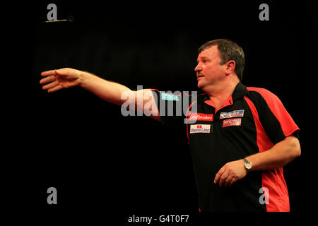 Terry Jenkins in action against Joe Cullen during the Ladbrokes.com ...