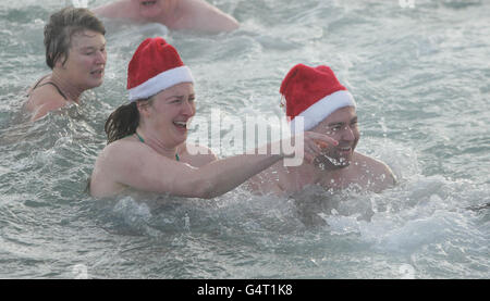 STANDALONE Photo. Hundreds of people at the annual Forty Foot Christmas Day Swim at Sandycove, Dublin. Stock Photo