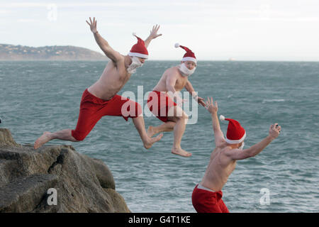 STANDALONE Photo. Hundreds of people at the annual Forty Foot Christmas Day Swim at Sandycove, Dublin. Stock Photo