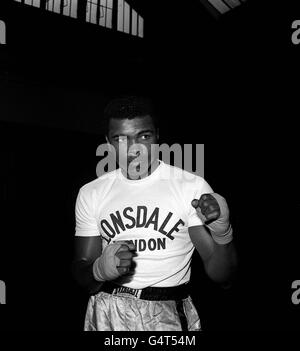 Muhammad Ali, then known as Cassius Clay, in training pior to defending his world heavyweight championship title against Henry Cooper in London. Stock Photo