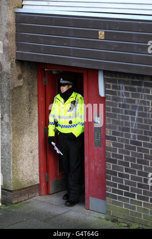 Police at the scene near Antigua Street in Greenock, Inverclyde after a murder inquiry was launched after the body of Jack Doyle was discovered on Tuesday. He was the nephew of Elaine Doyle, who was also murdered in Greenock over 25 years ago. Stock Photo