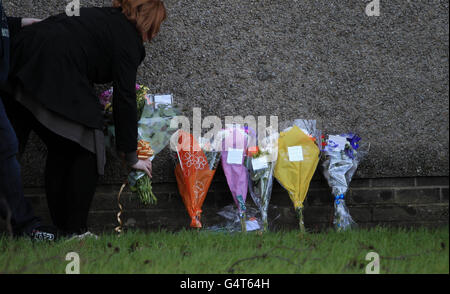 Flowers left at the scene near Antigua Street in Greenock, Inverclyde after a murder inquiry was launched after the body of Jack Doyle was discovered on Tuesday. He was the nephew of Elaine Doyle, who was also murdered in Greenock over 25 years ago. Stock Photo