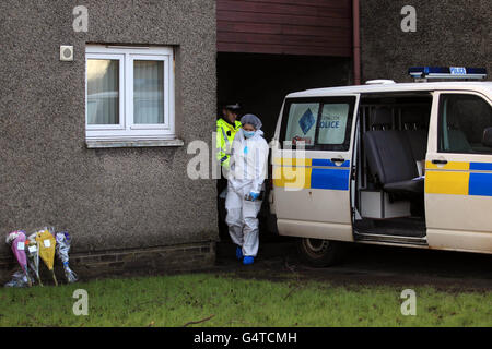 Police at the scene near Antigua Street in Greenock, Inverclyde after a murder inquiry was launched after the body of Jack Doyle was discovered on Tuesday. He was the nephew of Elaine Doyle, who was also murdered in Greenock over 25 years ago. Stock Photo