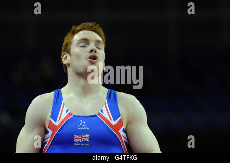 Great Britain's Daniel Purvis reacts as he goes on to win Gold on the Floor during the Men's Individual final during the Visa International Gymnastics at the North Greenwich Arena, London. Stock Photo