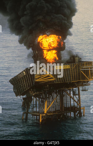 A fire burns on the North Sea oil rig Piper Alpha after an explosion that killed more than 160 people. Stock Photo