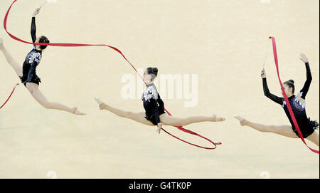 Gymnastics - Visa International Gymnastics - Day Nine - North Greenwich Arena. Great Britain perform during the Group All Round Final during the Visa International Gymnastics at the North Greenwich Arena, London. Stock Photo