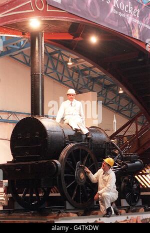 Early Locomotive Consultants, John Glithero and Dr Michael Bailey (R) examine the original Stephenson's Rocket at the National Railway Museum in York. The consultants have revealed that most modern images of the famous engine are in fact wrong. * Including the drawing on the current 5 note. Stock Photo