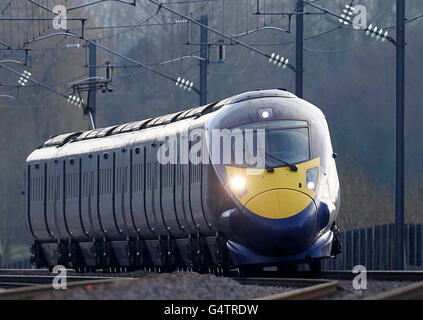 A general view of a Hitachi Class 395 Javelin train as it passes through Ashford, Kent, using the HS1 Channel Tunnel Rail Link as a controversial new high-speed rail line between London and Birmingham has been given the go-ahead by government. Stock Photo