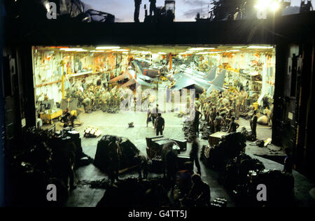 Dawn breaks over the South Atlantic and hidden from view in one of the hangars of the carrier HMS Hermes is some of the might of the British naval task force sailing south for the Falkland Islands. Stock Photo