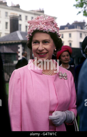 Queen Elizabeth II at the garden party in the grounds of the Royal Hospital, Chelsea, London, in connection with the 50th anniversary of the Women's Services. Stock Photo