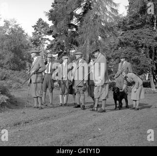 Lord Swinton (left), double-barrel gun under his arm, scans the North Yorkshire Moors with some of his guests before moving off for a 'Glorious 12th' grouse shoot. Foreground, right, is Minister of Agriculture Christopher Soames (trilby) Stock Photo