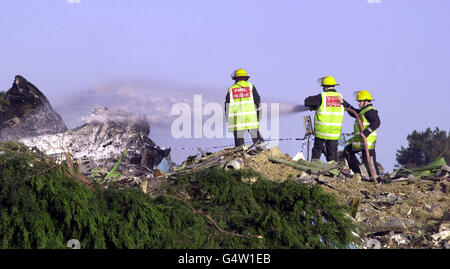 Fire crews at the scene where a Korean 747 cargo jet crashed shortly after take off from Stansted Airport. The plane came down in open fields close to Beggar's Hall Farm in Essex, just south of the airport, killing the four crew members on board. Stock Photo